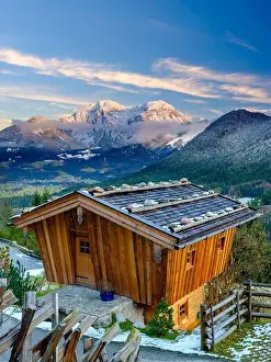 Log Cabin Prints: Traditional wooden hut, behind it the massif of the Hohen Goell in winter