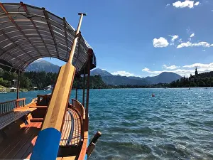 Island Shore Prints: Traditional wooden Pletna boat trip to Bled Island, Slovenia