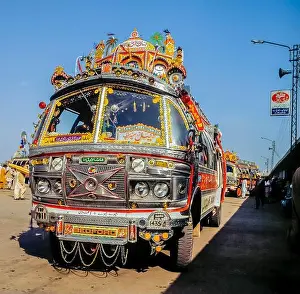 Transporter Prints: Traditionally decorated Pakistani busat bus terminal in Islamabad, Pakistan