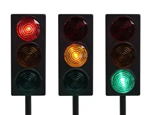 Traffic Lights Prints: Three traffic lights with red yellow and green lights cut out on white background