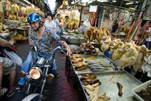 Alleyway Prints: Traffic passing fresh food stall in narrow alleyway Trok Issaranuphap in central Chinatown in Bangkok Thailand