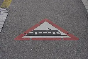 Street Sign Prints: Traffic sign for tram crossing ahead painted on the ground