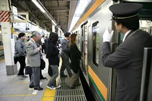 Asians Prints: Train conductor at platform for JR-Line local trains, Tokyo Station, Tokyo, Japan, Asia