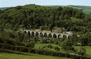 Arched Prints: Train on Heart of Wales Line crossing Knucklas Viaduct, Powys, Wales, UK