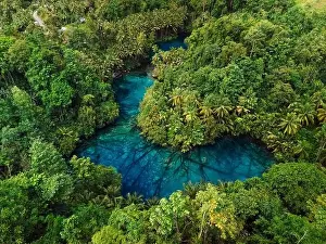 Banggai Prints: Most transparent lake with crystal blue fresh water in Indonesia. Drone view