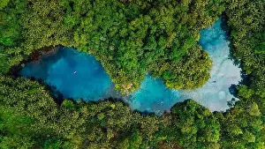 Banggai Prints: Most transparent lake with crystal blue fresh water in Sulawesi, Indonesia. Drone view