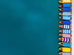 Bled Prints: Travel Background. Colorful Boats on Lake. Top Down Aerial Drone Photo