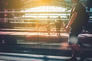 Leaving Prints: Travel concept, people with luggage walking on train station platform