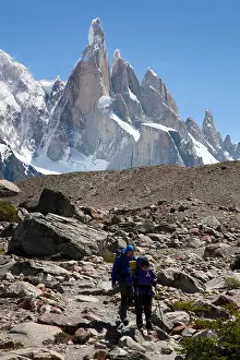 Trekkers Prints: Trekkers and Cerro Torre peak. Los Glaciares National Park. Patagonia. Argentina