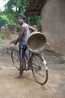 Primeval Prints: Tribal man on a bicycle. Munda tribe