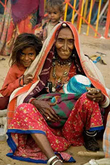 Rajasthani Prints: Tribal woman and children at Pushkar Camel Fair, Rajasthan, India