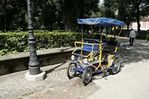 Vacant Prints: trike rickshaw in villa borghese park, rome italy
