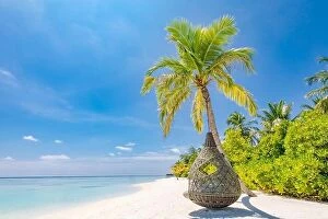 Images Dated 17th December 2018: Tropical beach background as summer landscape with beach swing or hammock and white sand