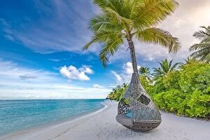 Images Dated 26th May 2019: Tropical beach background as summer landscape with beach swing or hammock and white sand