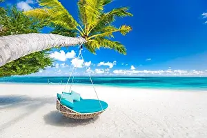 Tropical beach background as summer landscape with beach swing or hammock and white sand and calm sea for beach banner. Perfect beach scene vacation