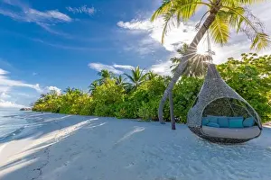 Tropical beach background as summer landscape with beach swing or hammock and white sand and calm sea for beach banner. Perfect beach scene vacation