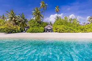 Tropical beach background as summer landscape with white sand and coco palm trees close to calm sea for beach banner. Perfect beach scene vacation
