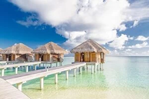 Images Dated 16th December 2015: Tropical beach in Maldives with luxury over water bungalows or villas
