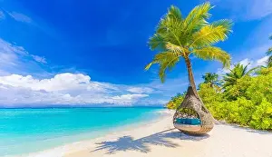 Tropical beach paradise as summer landscape, beach swing hammock and white sand, calm sea serene beach. Luxury beach resort hotel vacation holiday