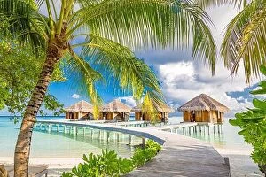 Images Dated 16th December 2015: Tropical beach with water bungalows on the Maldives. Amazing shore coastline