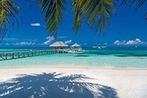 Images Dated 20th December 2015: Tropical beach with water bungalows on the Maldives. Amazing shore coastline