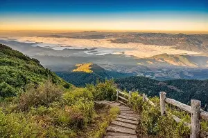 Doi Inthanon Prints: Tropical forest nature landscape view with toursits mountain range and moving cloud mist at Kew Mae Pan nature trail