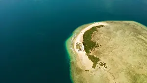 Tropical Island Prints: Tropical island and sandy beach with tourists surrounded by coral reef and blue sea in honda bay