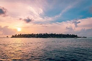 Images Dated 11th March 2019: Tropical island view from sea. Sunset sky clouds, peaceful nature seascape