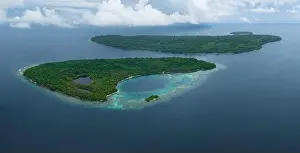 Tropical islands are fringed by coral reefs in the Solomon Islands. This beautiful South Pacific country is home to spectacular marine biodiversity