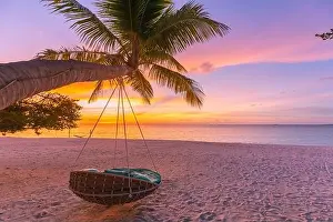 Sunset Beach Prints: Tropical sunset beach background as summer landscape panorama with beach swing hammock and white sand