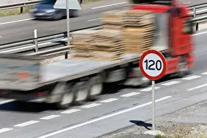 Quick Prints: Truck passing 120 kilometer per hour speed limit sign on motorway, Spain