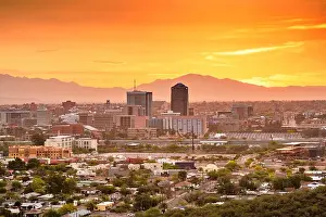 Tucson, Arizona, USA downtown city skyline with mountains at twilight