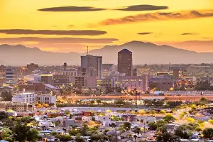 Tucson, Arizona, USA downtown city skyline with mountains at twilight