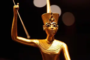 Tutankhamun Prints: Tutankhamun exhibition in Malmoe Sweden 2013 - Gilded wooden figure of Tutankhamun on a skiff