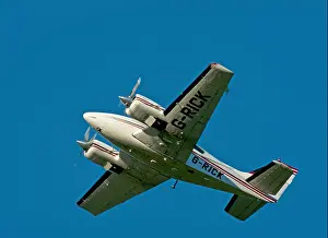 Developed Prints: Twin Engined Propellor driven Cessna 421C Golden Eagle light aircraft over Inverness