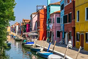 Northern Italy Prints: Typical bright colorful houses in Burano along a canal, Italy
