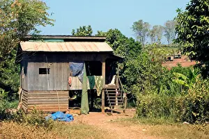 Khmer Prints: A typical Cambodian wooden home on stilts is part of the rural landscape in Ban Lung