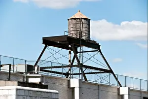 Water Tower Prints: typical New York City rooftop wood water tower on steel frame superstructure