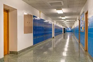 Lockers Prints: Typical, nondescript USA empty school hallway with blue metal lockers along a hallway