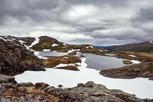 Images Dated 8th July 2017: Typical norwegian landscape with snowy mountains and clear lake near the famous Aurlandsvegen