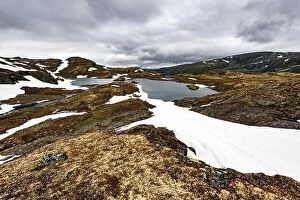 Landscape Collection: Typical norwegian landscape with snowy mountains and clear lake near the famous Aurlandsvegen