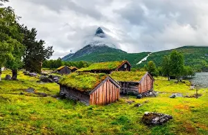 Typical norwegian old wooden houses with grass roofs in Innerdalen - Norway's most beautiful mountain valley, near Innerdalsvatna lake