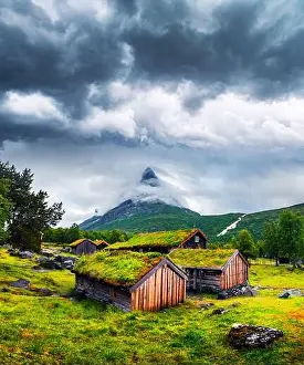 Typical norwegian old wooden houses with grass roofs in Innerdalen - Norway's most beautiful mountain valley, near Innerdalsvatna lake
