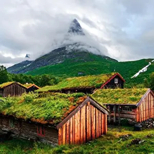 Landscape Prints: Typical norwegian old wooden houses with grass roofs in Innerdalen - Norway's most beautiful mountain valley