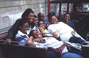 Southern Africa Prints: Uk London Black Tourists on Open Top Bus Having Picture Taken