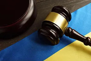 Judicial Prints: Ukrainian flag and gavel in the court as symbol of justice in Ukraine