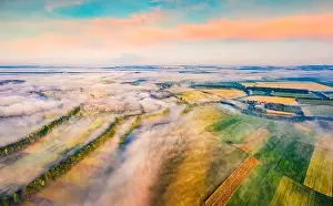 Unbelievable summer view from flying drone of Ukrainian countryside with field of wheat