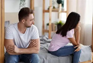 Quarrel Prints: Unhappy Husband And Wife After Quarrel Sitting On Bed
