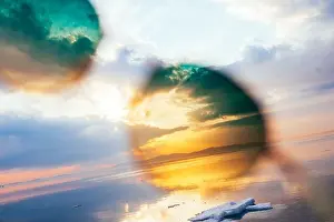 Sea Water Prints: Unusual and bright colorful image of the sunset through sunglasses