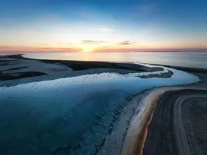 Unusual islands on a brilliant lake, top view, drone camera